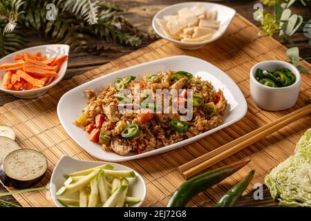 Healthy homemade fried rice with chicken stripes and vegetables Stock Photo