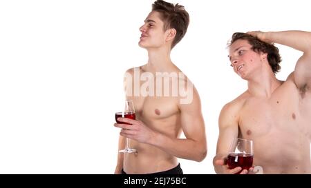 Holidays and weekends. Young attractive couple drinking red wine. White background. Stock Photo