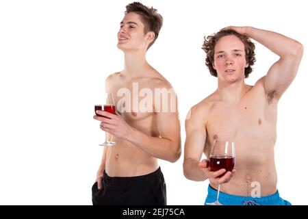 Holidays and weekends. Young attractive couple drinking red wine. White background. Stock Photo