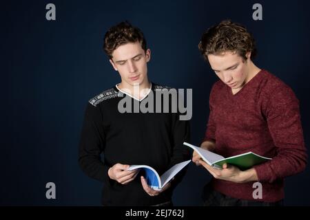 Study and work. Two young attractive students with laptops. Stock Photo