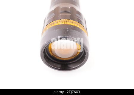 black metal flashlight on a white background Stock Photo