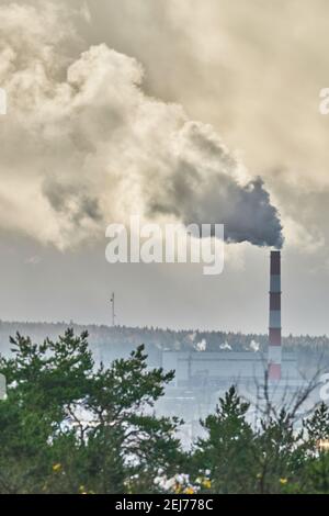 smoke from the chimney over the city Stock Photo