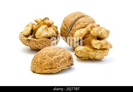 Walnuts, whole and opened on white background Stock Photo
