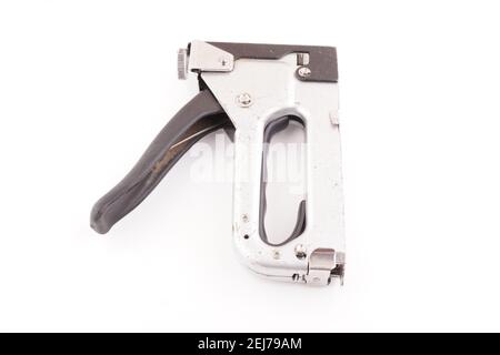 metal construction stapler on white background Stock Photo