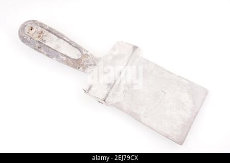 dirty spatula for putty on a white background Stock Photo