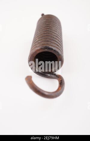 rusty spring on white background Stock Photo