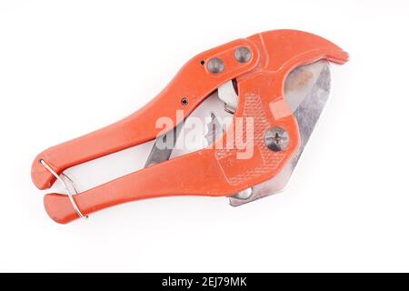 red knife for plastic pipes on a white background Stock Photo