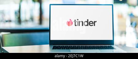 POZNAN, POL - SEP 23, 2020: Laptop computer displaying logo of Tinder, a location-based social search mobile app most often used as a dating site. Stock Photo