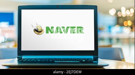 POZNAN, POL - AUG 8, 2020: Laptop computer displaying logo of Naver, a South Korean online platform operated by Naver Corporation. Stock Photo