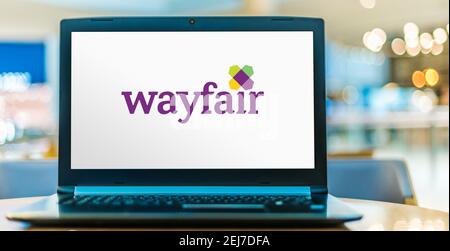 POZNAN, POL - AUG 8, 2020: Laptop computer displaying logo of Wayfair, an American e-commerce company that sells furniture and home-goods Stock Photo