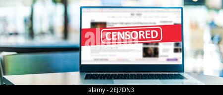 Laptop computer displaying the sign of censorship on an internet news site Stock Photo