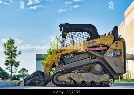 Houston, Texas USA 06-14-2020: Caterpillar 259D compact track loader parked unmanned, side view. Stock Photo