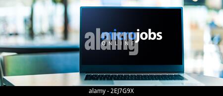 Laptop computer displaying the sign "micro jobs online" Stock Photo