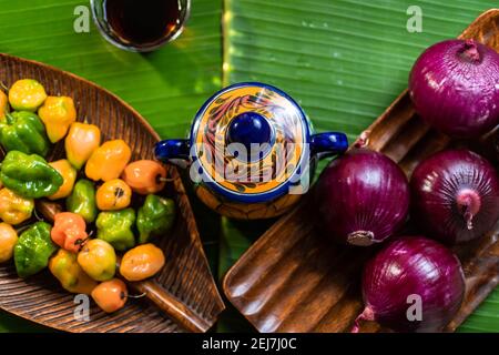 basic ingredients for hot sauce on tropical table in typical Mexican kitchen Stock Photo