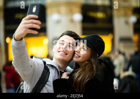 Couple of turists taking a selfie in the city Stock Photo