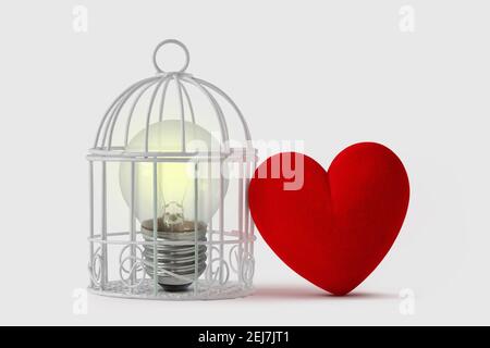 Light bulb in bird cage with free heart - Mind and heart concept Stock Photo