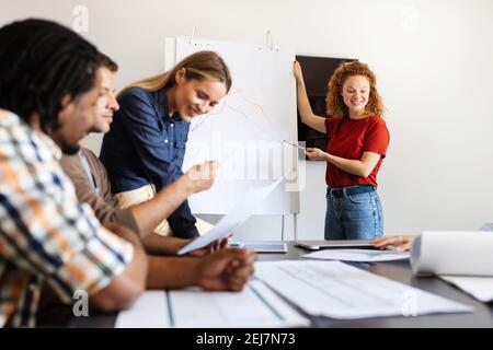 Group of successful business people designers architects in office Stock Photo