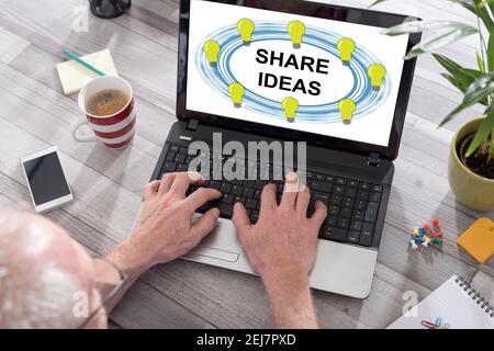 Share ideas concept shown on a laptop used by a man Stock Photo