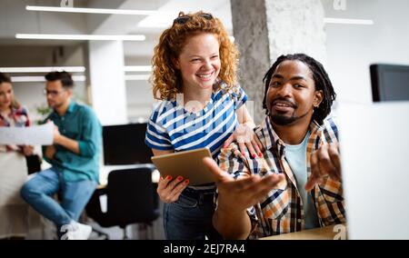 Company employees working in software development and designer office Stock Photo