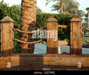 Large wooden handrails in a tropical setting. Stock Photo