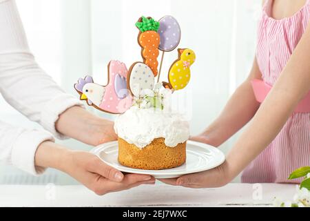 Easter composition with a beautifully decorated Easter cake. The concept of preparing for the family holiday Easter. Stock Photo
