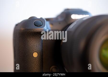 Close up of a part of a camera with a button in focus. Stock Photo