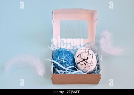 Two eggs in a paper box. Hand made. An Easter gift. Stock Photo