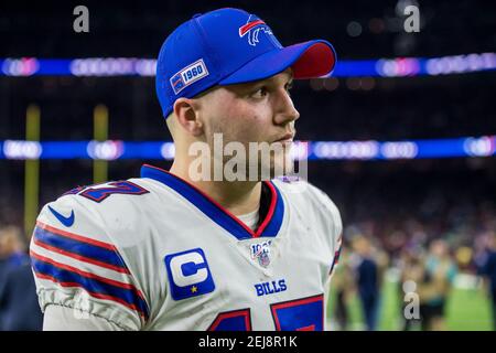 January 4, 2020: Buffalo Bills quarterback Josh Allen (17) takes a hard hit  from Houston Texans inside linebacker Zach Cunningham (41) during overtime  of an NFL football playoff game between the Buffalo