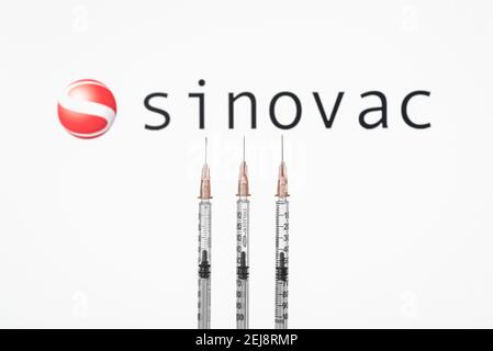 Izmir, Turkey - February 21 2021: Coronavirus vaccine concept and background. Sinovac vaccine syringes isolated on white background. Covid-19, 2019-nC Stock Photo