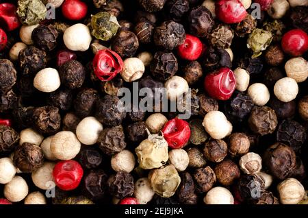 Black, white, green, and pink peppercorns. Stock Photo