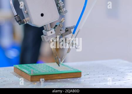 Process of selective soldering components to printed circuit boards at factory Stock Photo