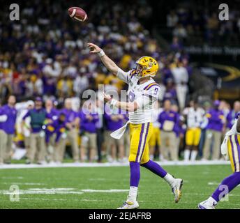 FILE - In this Jan. 1, 2019, file photo, LSU quarterback Joe Burrow attends  warmups before the Fiesta Bowl NCAA college football game against UCF in  Glendale, Ariz. This year, a group