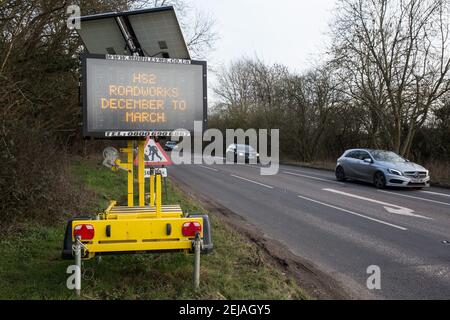 Chalfont St Giles, UK. 20th February, 2021. A sign alongside the A413 warns of roadworks and road closures at the junction with Bottom House Farm Lane for the HS2 high-speed rail link. A temporary haul road is being prepared alongside Bottom House Farm Lane for use in the construction of a ventilation shaft for the Chiltern Tunnel on the route of the HS2 high-speed rail link. Credit: Mark Kerrison/Alamy Live News Stock Photo