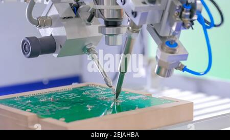 Process of selective soldering components to printed circuit boards at factory Stock Photo