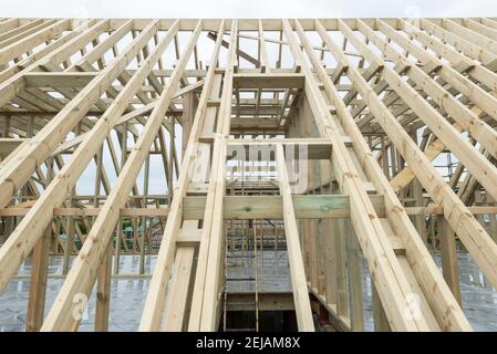 A residential house gets the roof converted to double the size of the house giving the owners more space. Stock Photo