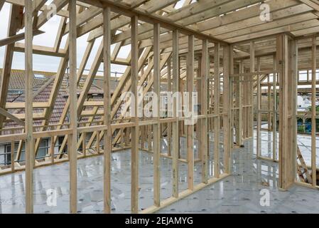 A residential house gets the roof converted to double the size of the house giving the owners more space. Stock Photo