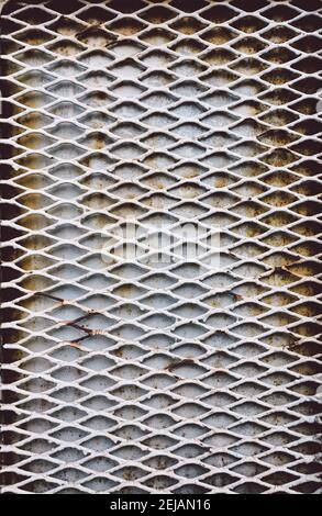 Rusty metal bars on a grunge old metal door. Background. Stock Photo