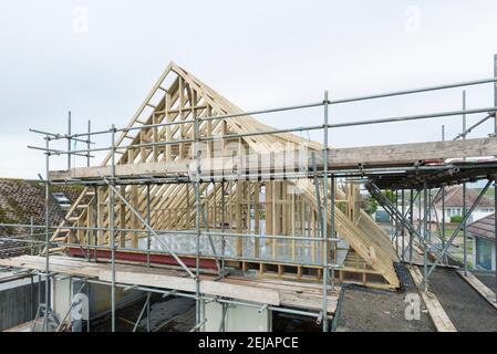 A residential house gets the roof converted to double the size of the house giving the owners more space. Stock Photo