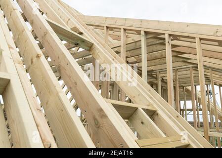 A residential house gets the roof converted to double the size of the house giving the owners more space. Stock Photo