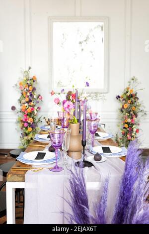 Beautiful flower composition on the wooden table Stock Photo