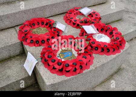 LEYTONSTONE, LONDON - 22ND FEBRUARY 2021: Poppy wreaths on the Leyton and Leytonstone war memorial. Stock Photo