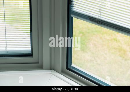 Details of modern double glazed windows with and without handles Stock Photo