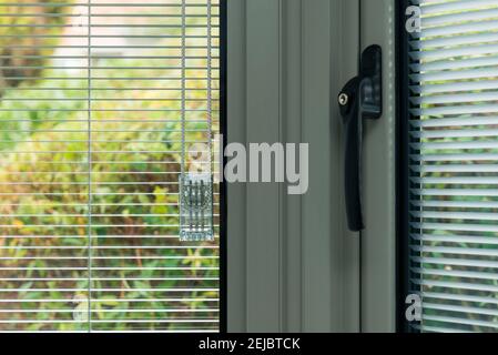 Details of modern double glazed windows with and without handles Stock Photo