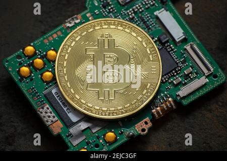 bitcoin logo coin on computer parts Stock Photo
