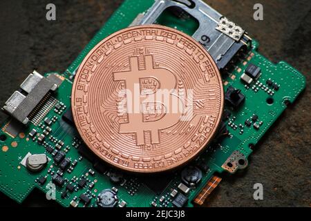 bitcoin logo coin on computer parts Stock Photo