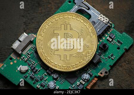 bitcoin logo coin on computer parts Stock Photo