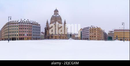 Panoramic view of the square Neumarkt and the Church of our Lady in winter, the square covered in snow. Stock Photo