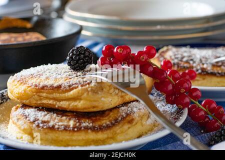 Dutch fluffy pancakes served on a breakfast table Stock Photo