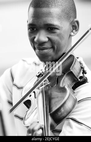 JOHANNESBURG, SOUTH AFRICA - Feb 20, 2021: Johannesburg, South Africa - August 28 2010: Diverse youth at music school orchestra Stock Photo