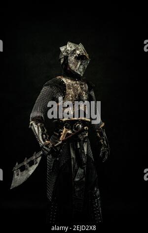 Medieval Fighter In Armor In Profile An Ax In His Hand Stock Photo Alamy